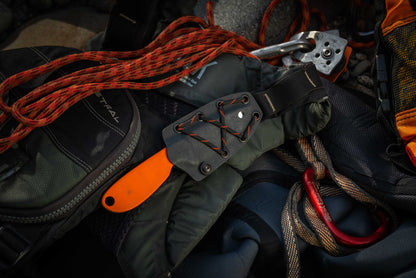 River Knife secured to an Astral PFD with paracord in the shoulder mounted position